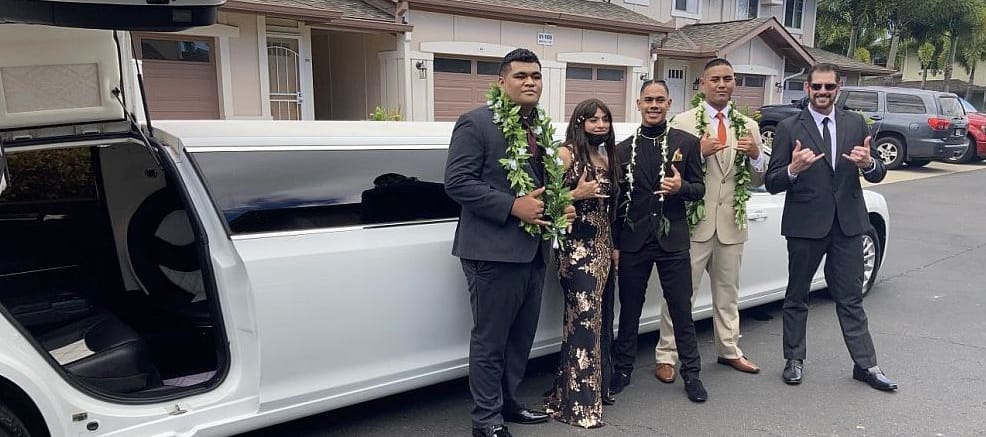 People Posing In Front Of The Limousine