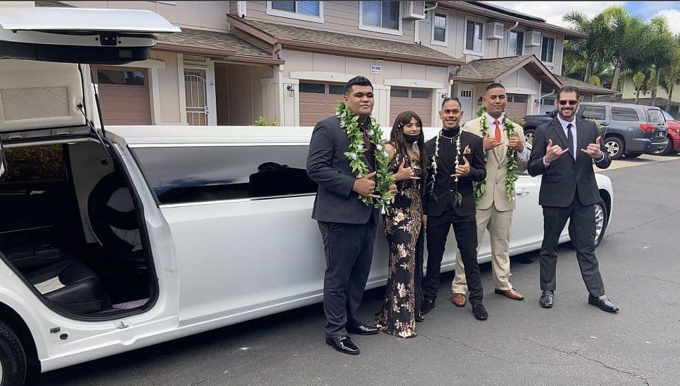 People Posing In Front Of The Limousine